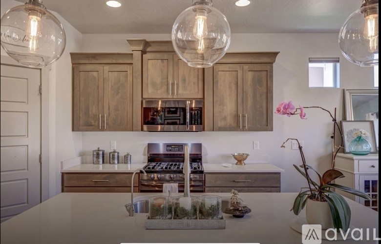 A kitchen with wooden cabinets and a white countertop.