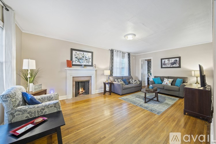 A living room with a fireplace and a couch.