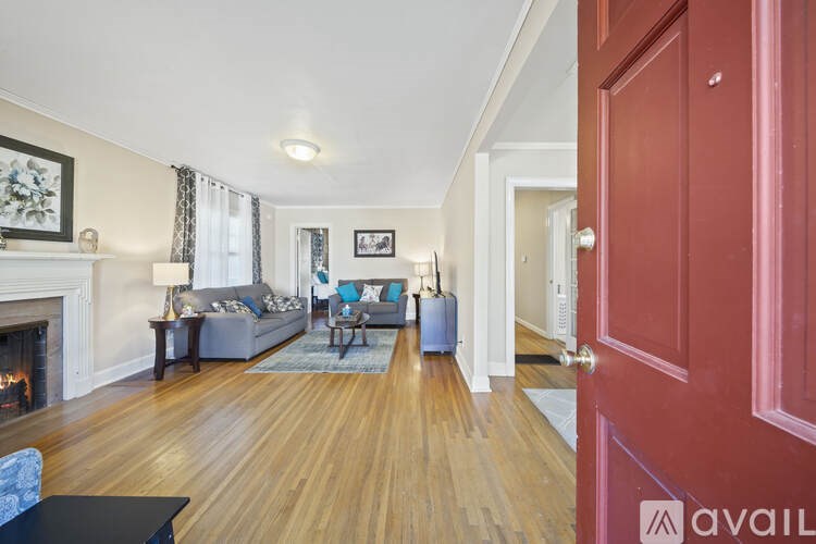 A living room with a fireplace and a couch.