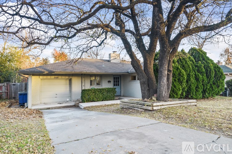 A house with a tree in front of it.