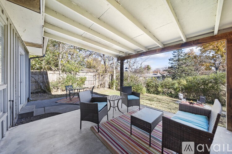 A patio with a table and chairs is available for rent.