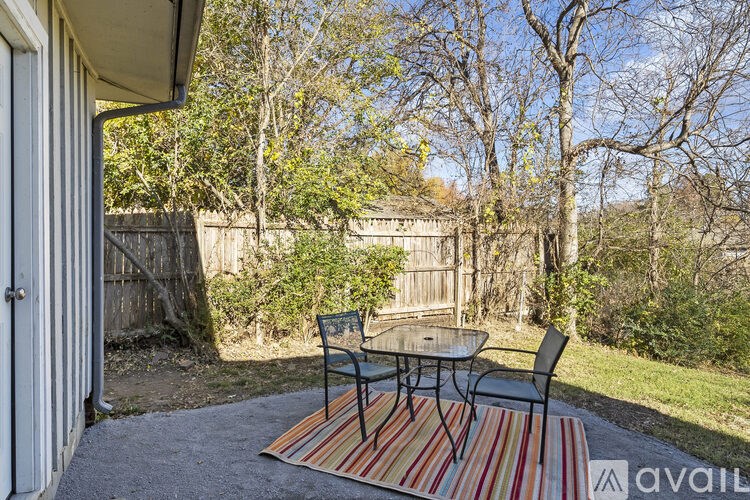 A patio with a table and chairs is available for rent.