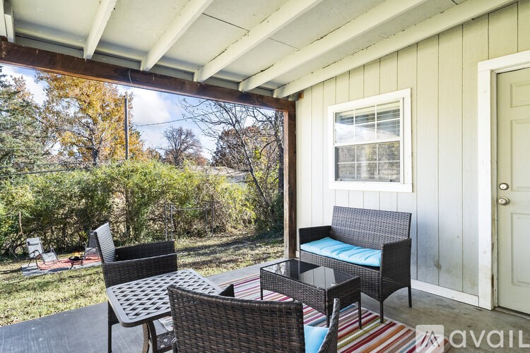 A patio with a table and chairs is available for rent.