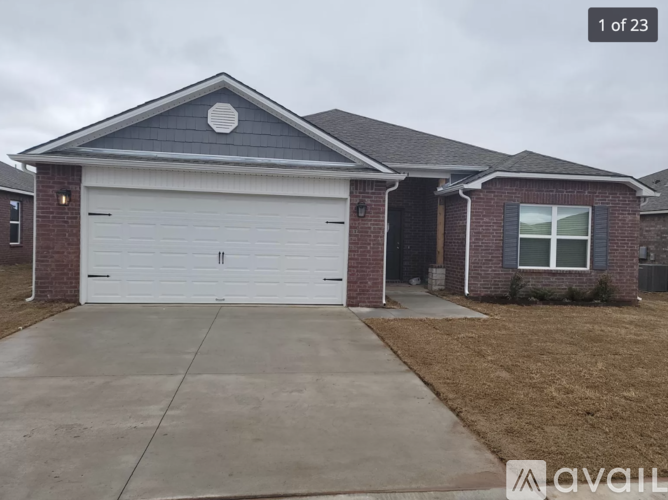 A house with a white garage door is for sale.