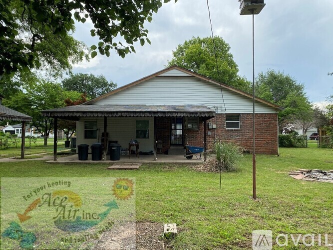 A house with a sign that says "Forever Heating" in front of it.