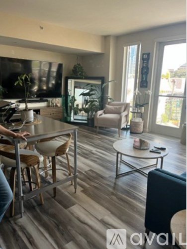 A living room with a grey sofa and a coffee table.