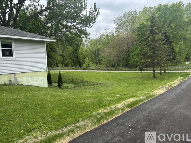 A house with a driveway in front of it.