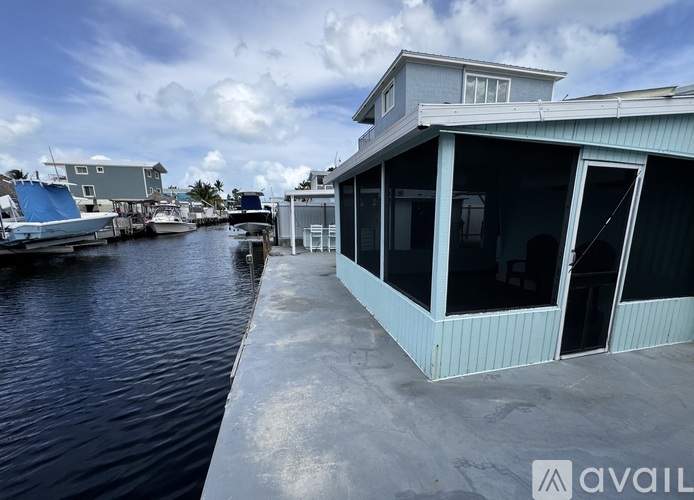 A house with a dock in front of it.