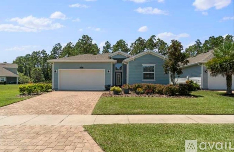 A house with a garage is for sale.