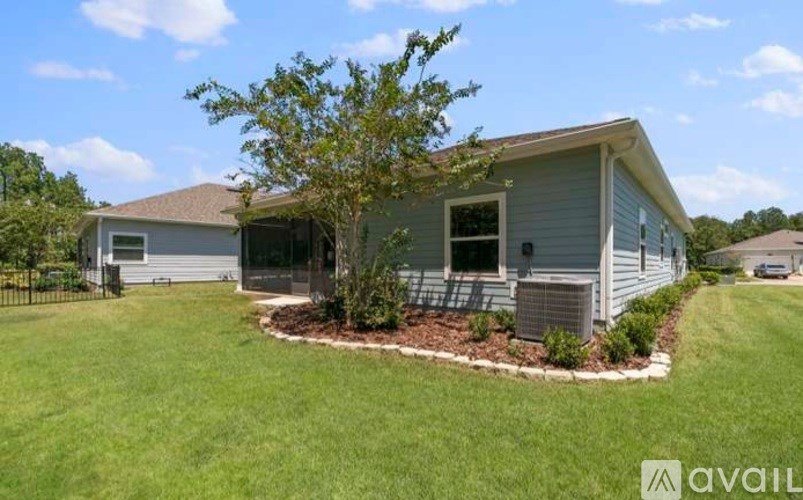A house with a tree in front of it.