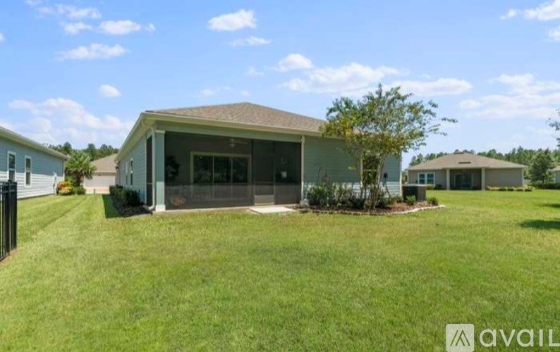 A house with a lawn in front of it is for sale.