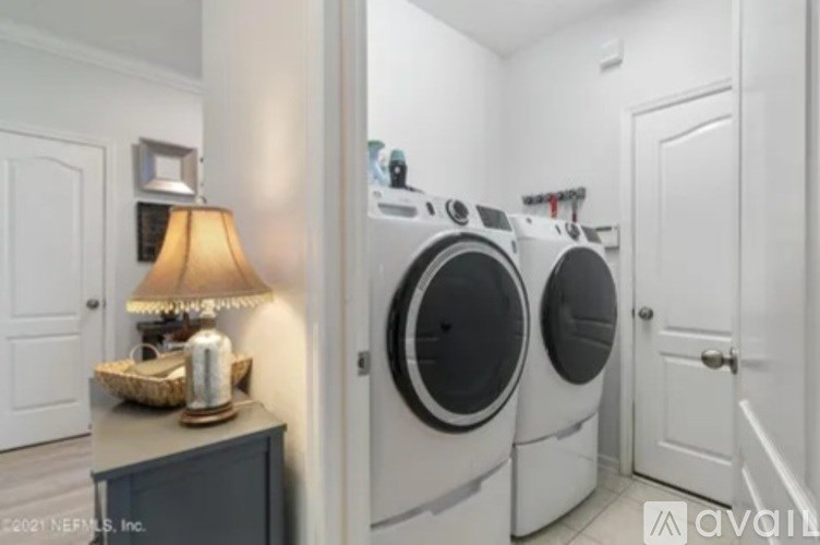 A laundry room with a washer and dryer.