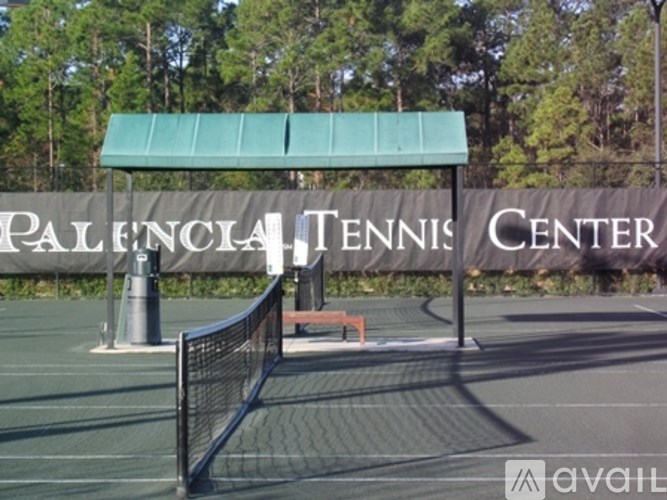 Palencial Tennis Center sign on a tennis court.
