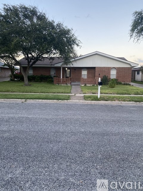 A house with a tree in front of it.