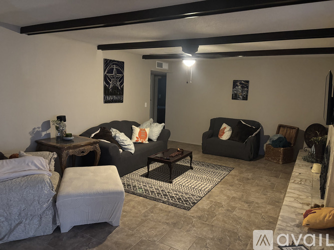 A room with a tiled floor and a ceiling fan.