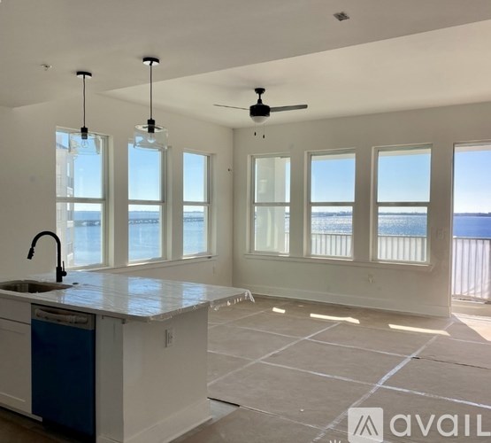 A white shelf with various containers on it.