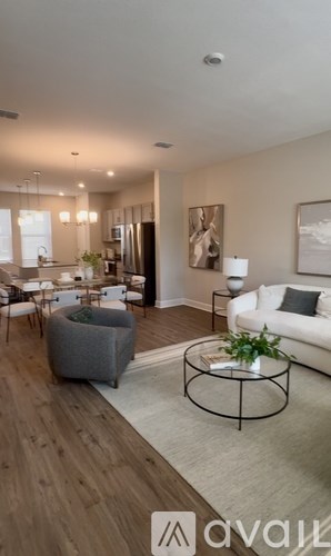 A modern living room with a grey sofa and a coffee table.