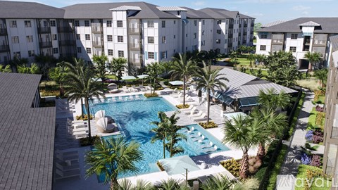 A large swimming pool surrounded by palm trees and buildings.