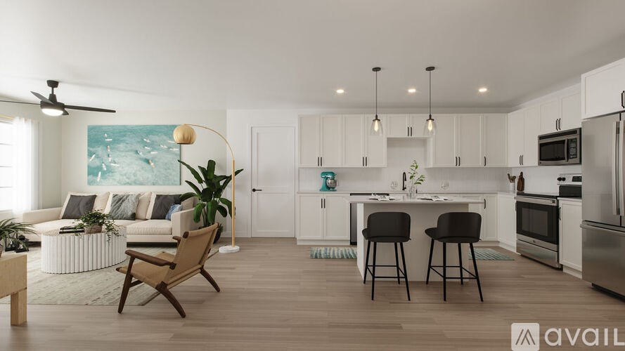 A modern kitchen with a dining area and a living room.