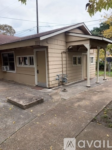 A small building with a porch and a door is shown.
