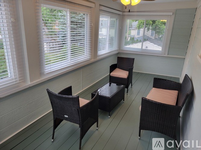 A patio with four chairs and a table is available for rent.
