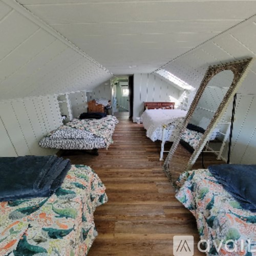 A room with a bed and a chair in it.