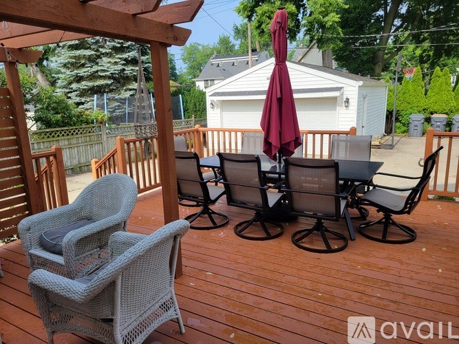 A patio with chairs and a table is available for rent.