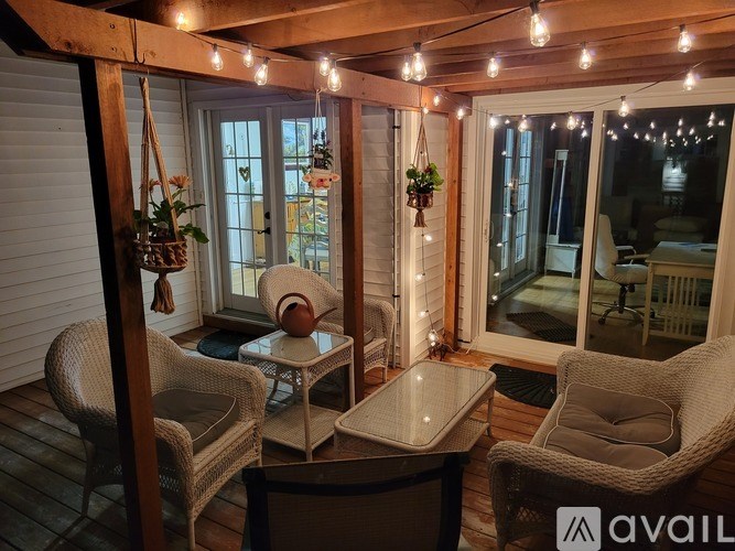 A cozy outdoor seating area with a table and chairs.