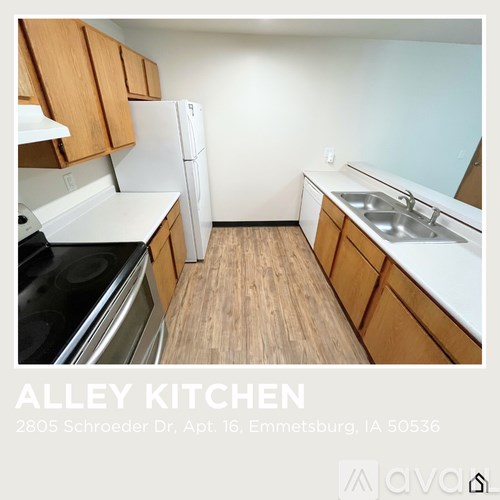 A kitchen with wooden cabinets and white appliances.