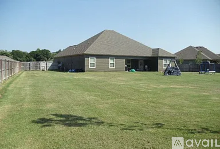 A house with a lawn in front of it.