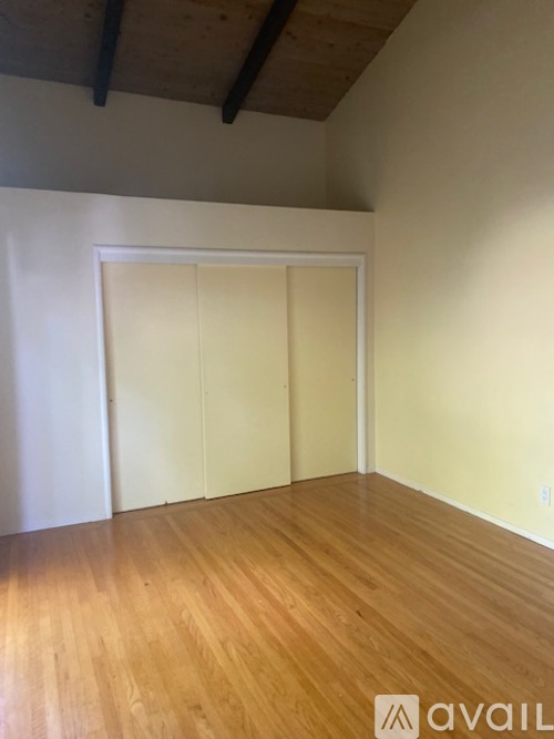 A room with wooden floors and white walls.