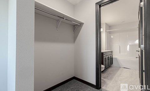 A bathroom with a toilet, sink, and mirror is shown.