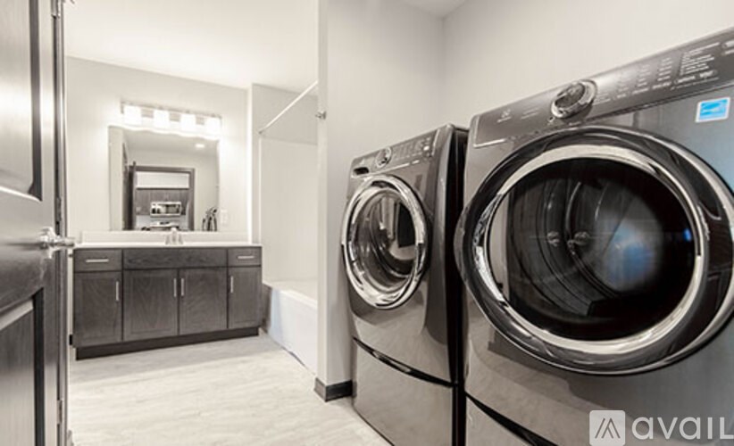 A laundry room with a washer and dryer.