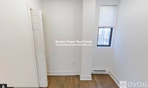 A room with a door and a window, and a website address is displayed.
