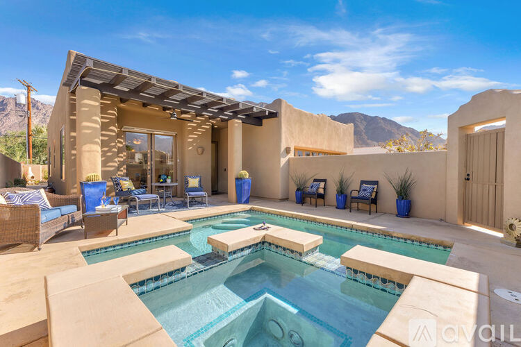 A modern house with a pool in the backyard.