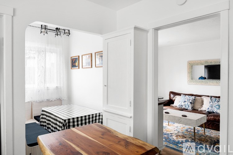 A room with a bed, a couch, and a coffee table.