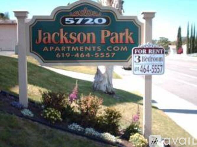 A sign for Jackson Park Apartments with a phone number for rentals.