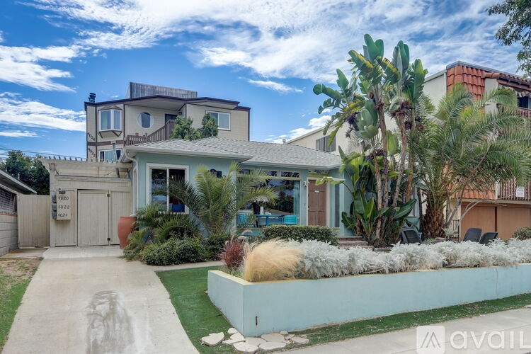 A house with a driveway and a sign that says "available".