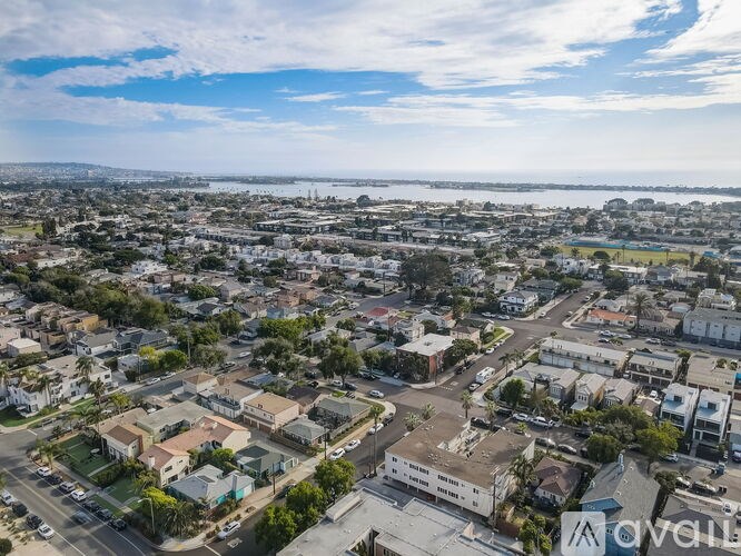 A bird's eye view of a residential area with houses and streets.