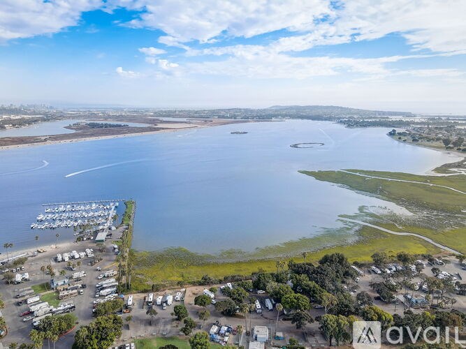 A marina with boats and a large body of water.