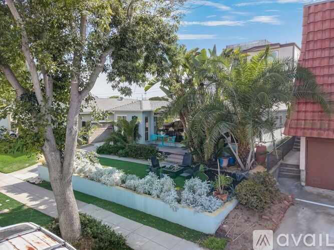 A well-maintained garden with a variety of plants and trees.