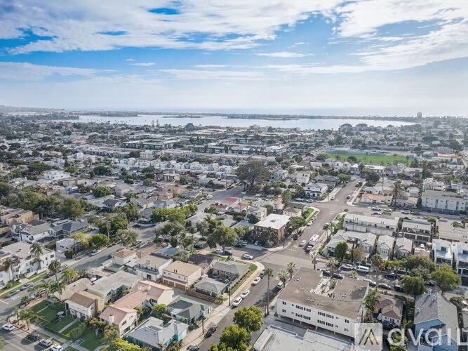 A bird's eye view of a residential area with houses and streets.