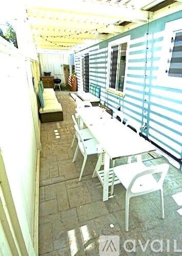 A patio with chairs and a table is shown.