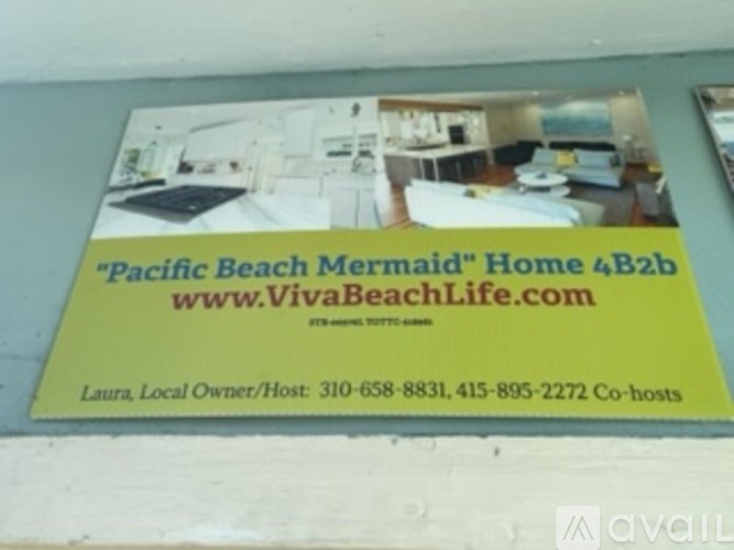 A sign advertising a "Pacific Beach Mermaid" home is displayed.