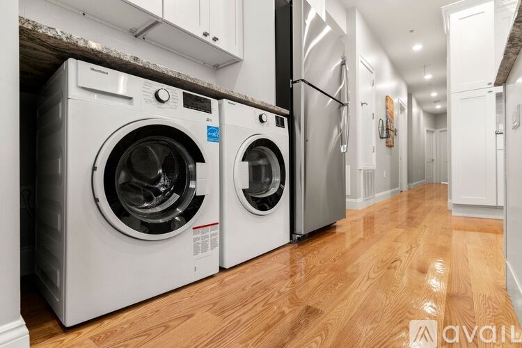 A row of washing machines are available for rent.