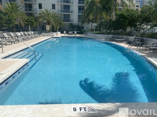 A swimming pool with a 5 feet depth sign.