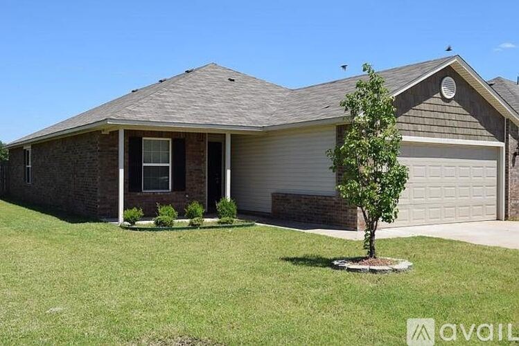 A house with a tree in front of it.