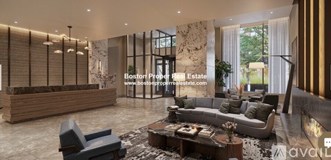 A modern living room with a sofa set, coffee table, and a reception desk.