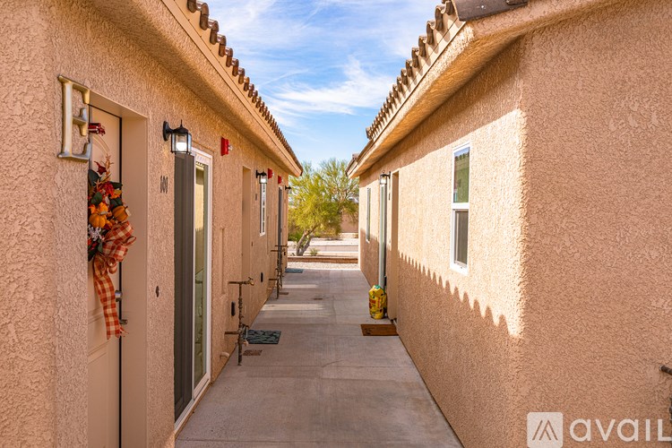 A row of houses with a clear blue sky above them.
