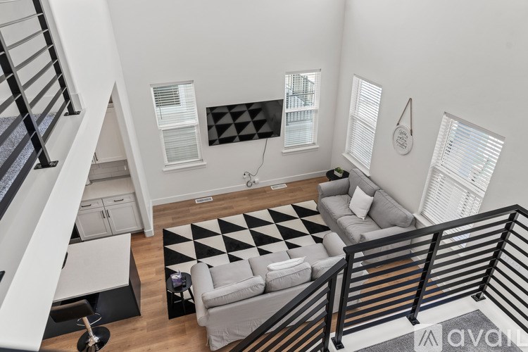 A black and white checkered rug in a living room.